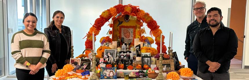 PhD in Clinical Psychology Diversity Committee Dia de los Muertos group photo with altar